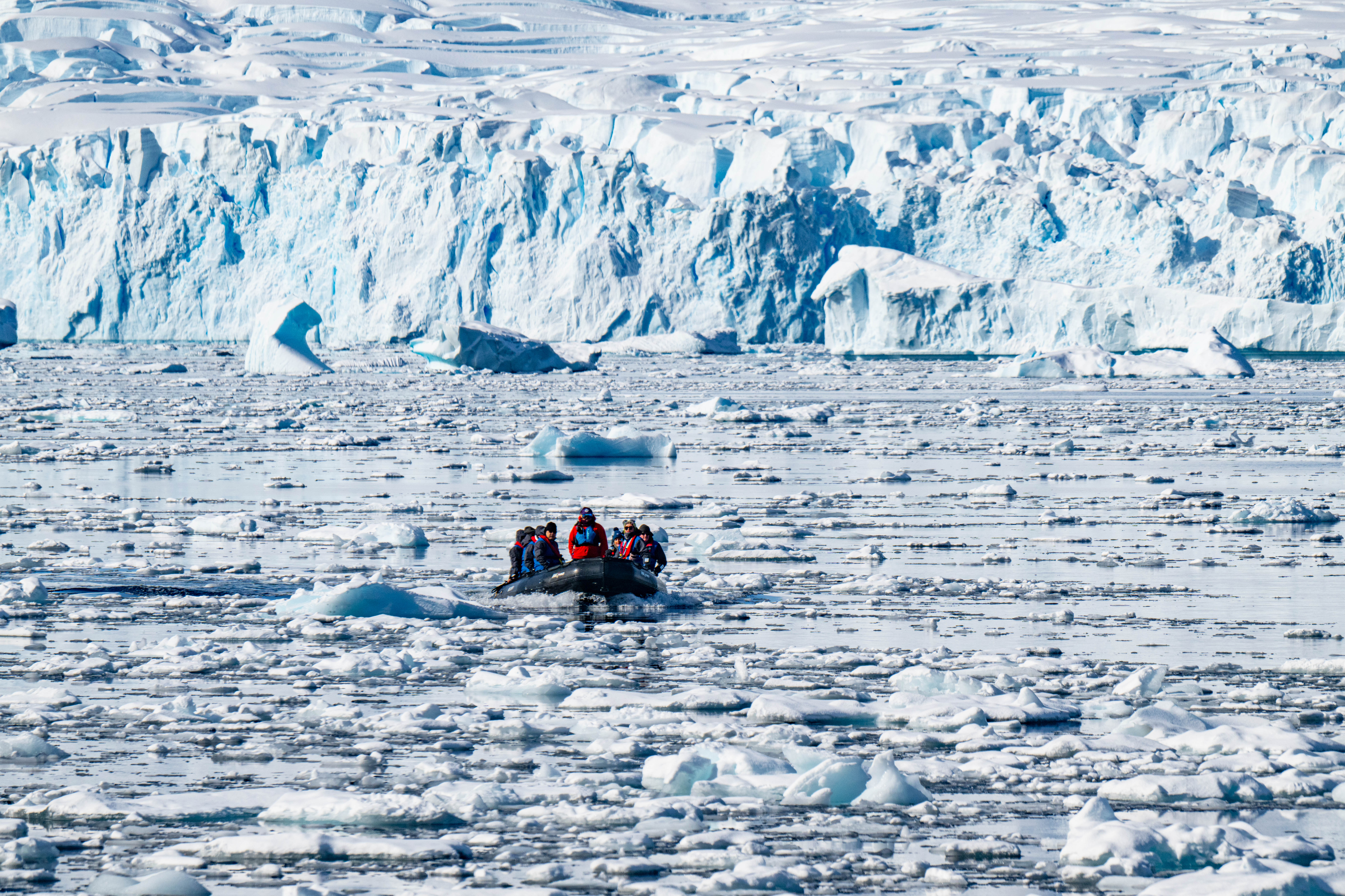 Zodiac cruise through secluded bays and quiet coves, scattered with drifting brash ice
